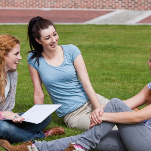 Happy students sitting together